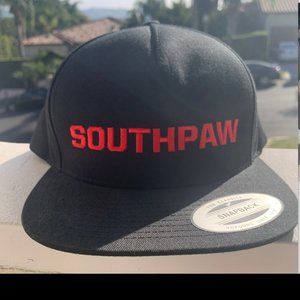 Black snapback hat with red "Southpaw" writing (never worn)